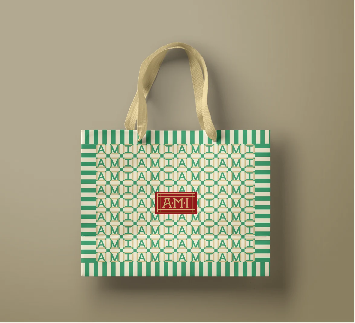 AMI patterned bag with natural handles on a neutral background