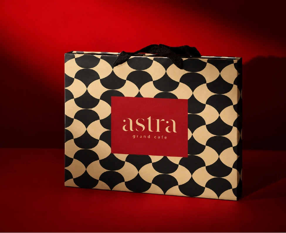 ASTRA patterned bag with a red wordmark panel on a red background