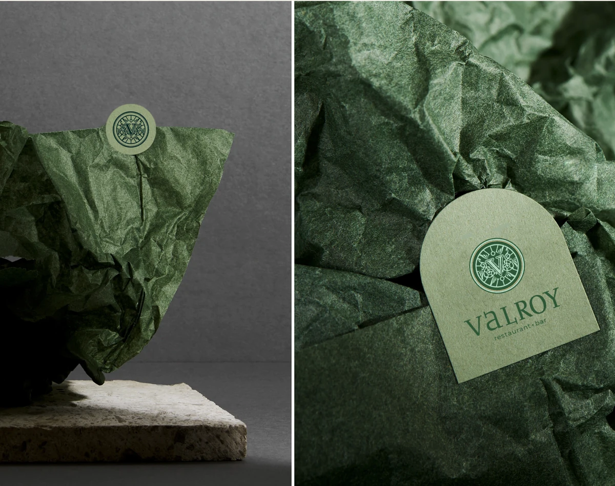 VALROY wrapped object and arched label on green tissue